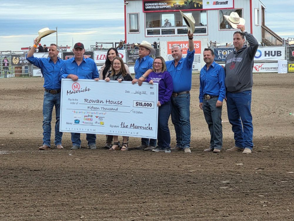 Big Hearted Mavericks cheque presentation to the Rowan House Society during the Battle of the Foothills. 