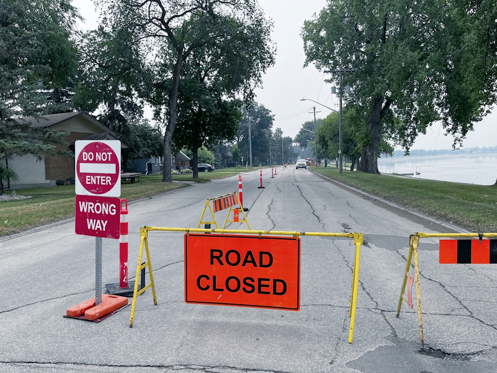 Construction work underway on Crescent Road in Portage la Prairie, showing heavy machinery and workers preparing the roadway.