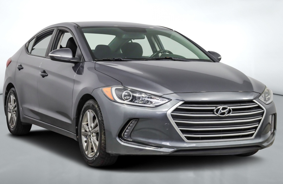 Front view of a silver 2018 Hyundai Elantra parked outdoors, resembling the vehicle stolen in Portage la Prairie, featuring a Winnipeg Jets licence plate.