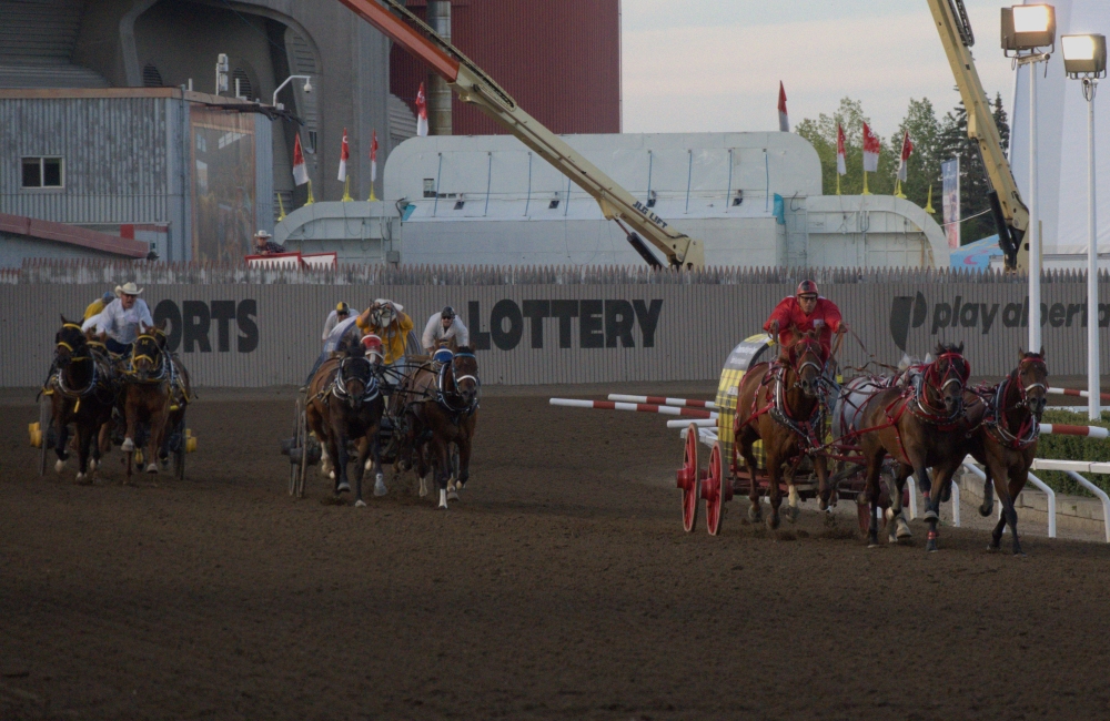 File photo of Jamie Laboucane (in red) racing down the backstretch at this year's Calgary Stampede. Okotoks Online/Harrison O'Nyons