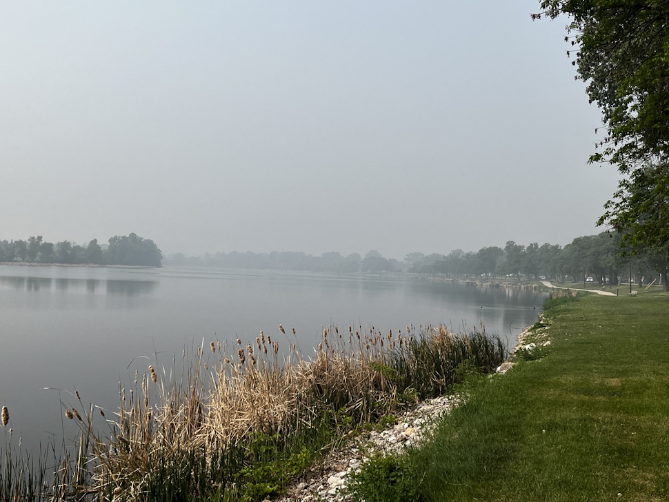 Smoke from distant wildfires hangs low over Crescent Lake in Portage la Prairie, as air quality warnings remain in effect across much of southern Manitoba. PortageOnline/Cory Knutt