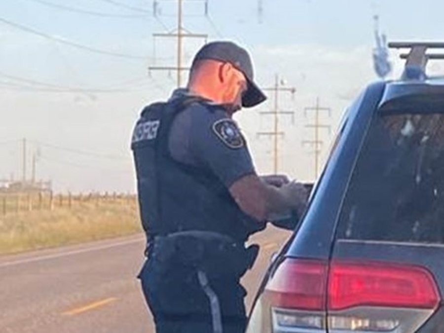 Police officer talking with a driver