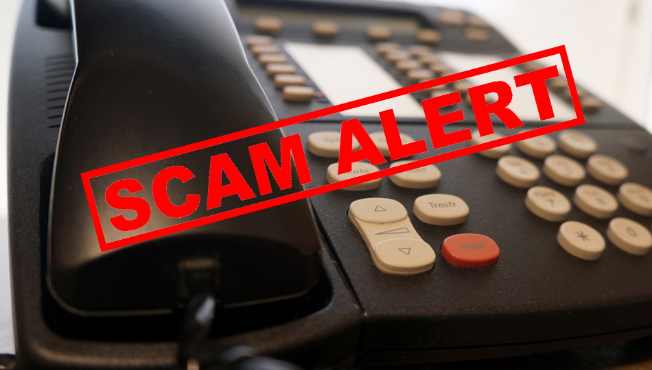 TABLE TELEPHONE WITH STAMPED SCAM ALERT NOTICE