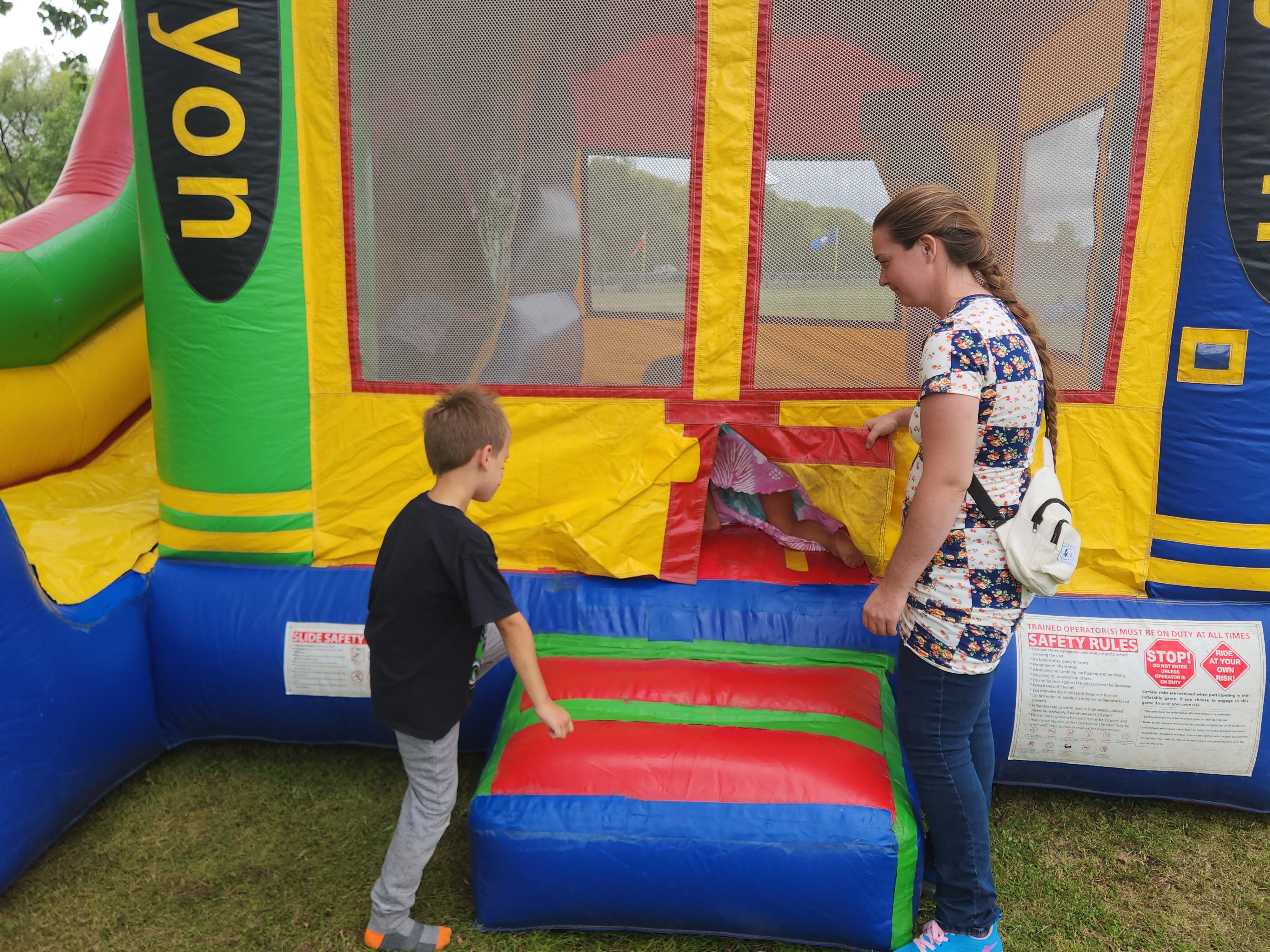 Kids enjoying Sundays activities, like the bouncy castle avaliable.
