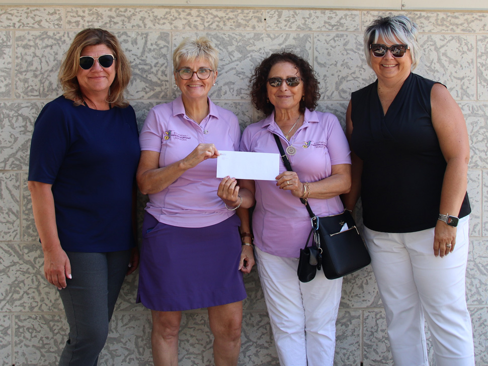 Representatives from SCU present a check to Heather Jowett and her team