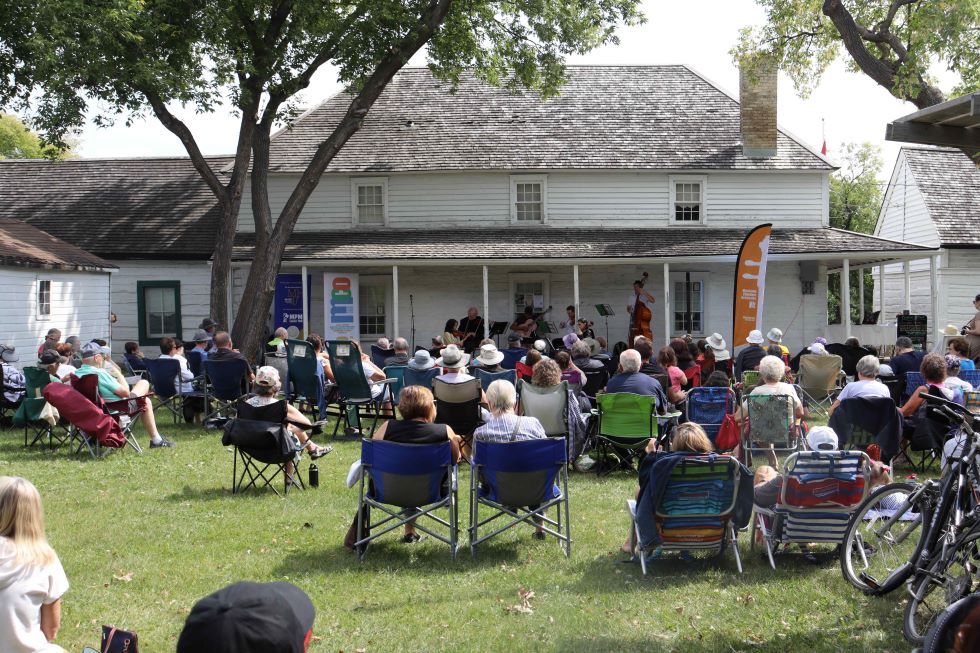 The Manitoba Chamber Orchestra performing on the veranda at the Seven Oaks House Museum. (Photo: MCO/Suzu Enns)