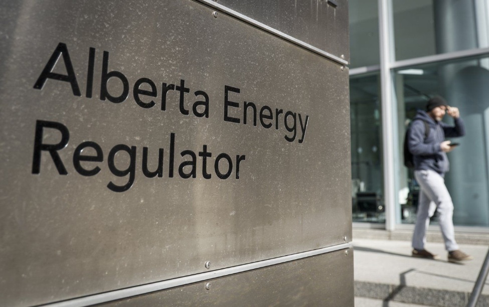 A person walks past the offices of the Alberta Energy Regulator in Calgary, Thursday, March 20, 2025. THE CANADIAN PRESS/Jeff McIntosh