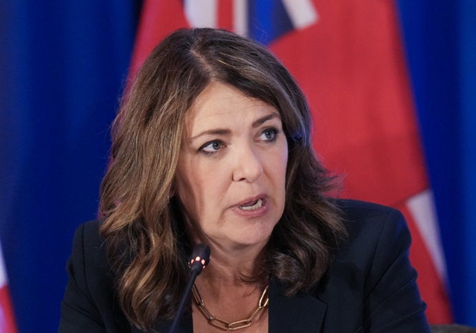 Alberta Premier Danielle Smith answers a question from the media during the meeting of Canada’s premiers in Huntsville, Ont., on Wednesday, July 23, 2025. THE CANADIAN PRESS/Nathan Denette