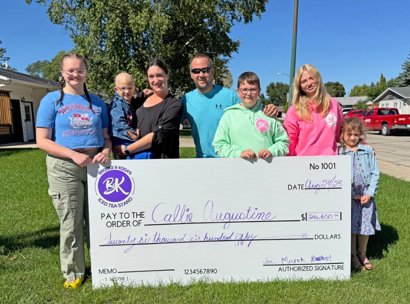 Brooke & Koda's Iced Tea Stand cheque presentation on Sunday afternoon. In photo from the left side: Dakota Reimer, Callie (being held), Sheyanna and Collin Augustine, Marek Hiebert, Brooke Peters and Hannah Augustine.