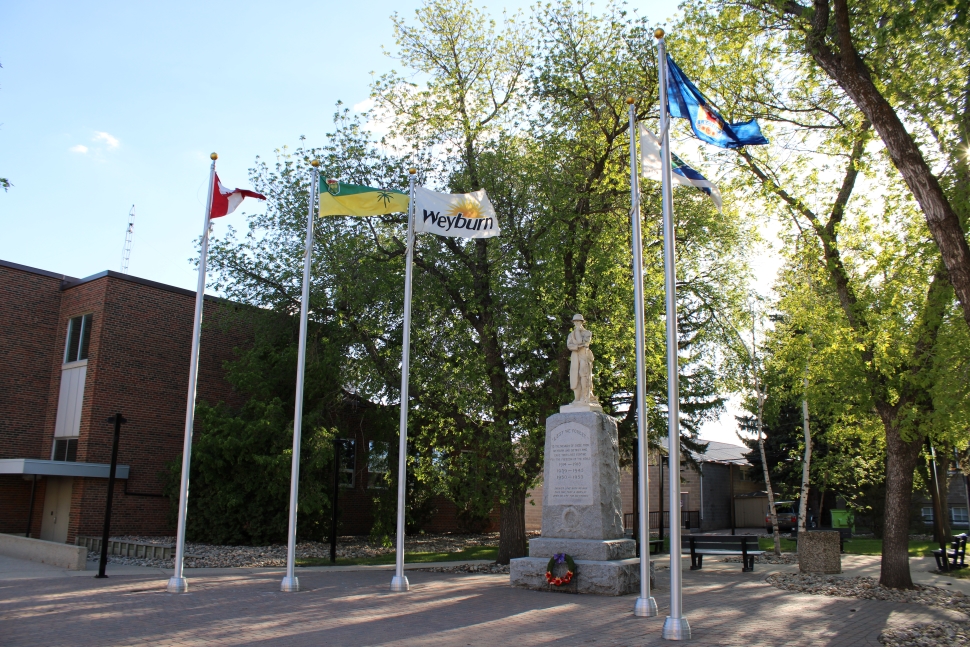 Flags raised in Memorial Park,beside Weyburn City Hall