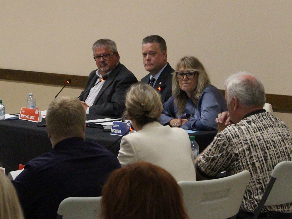 Spruce Woods candidates (l-r) Ray Berthelette (NDP), Stephen Reid (Liberal) and Colleen Robbins (PC) listen to a question from the panel