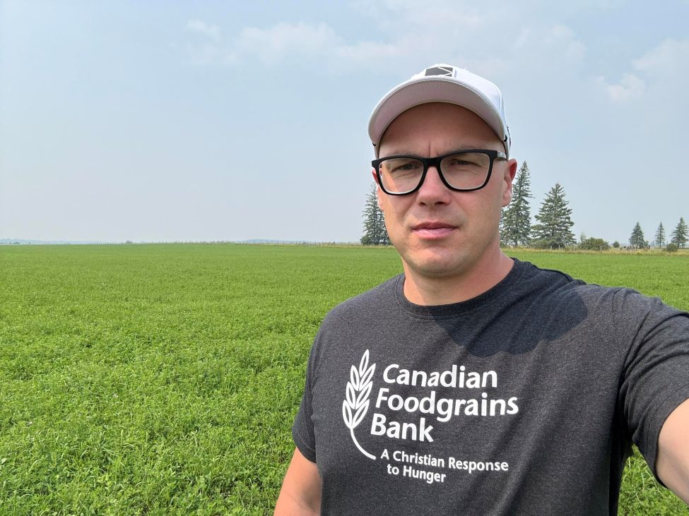 a man standing near a field