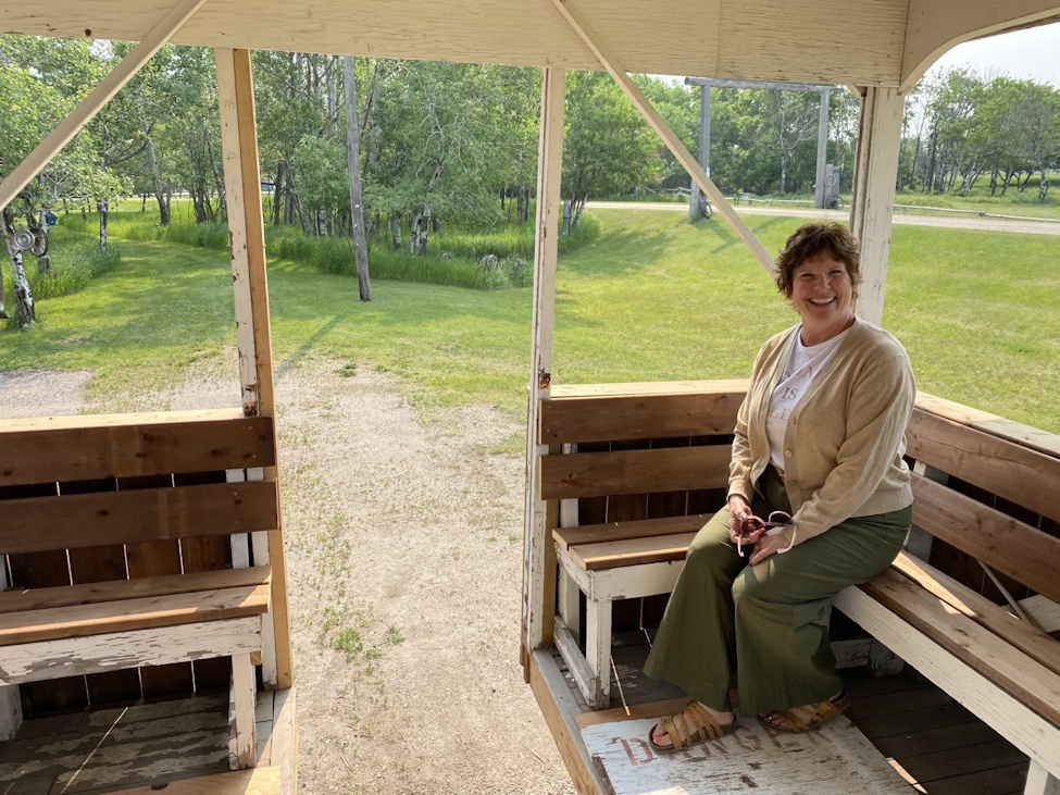 a woman sitting on the inside of the grandstand