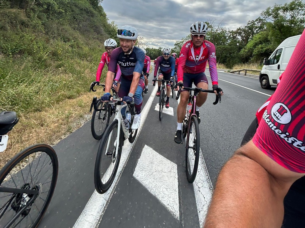 a group of cyclists on a highway 