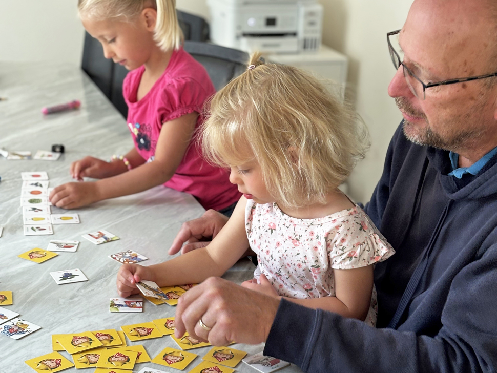 Grandpa with granddaughters spending time together this summer.