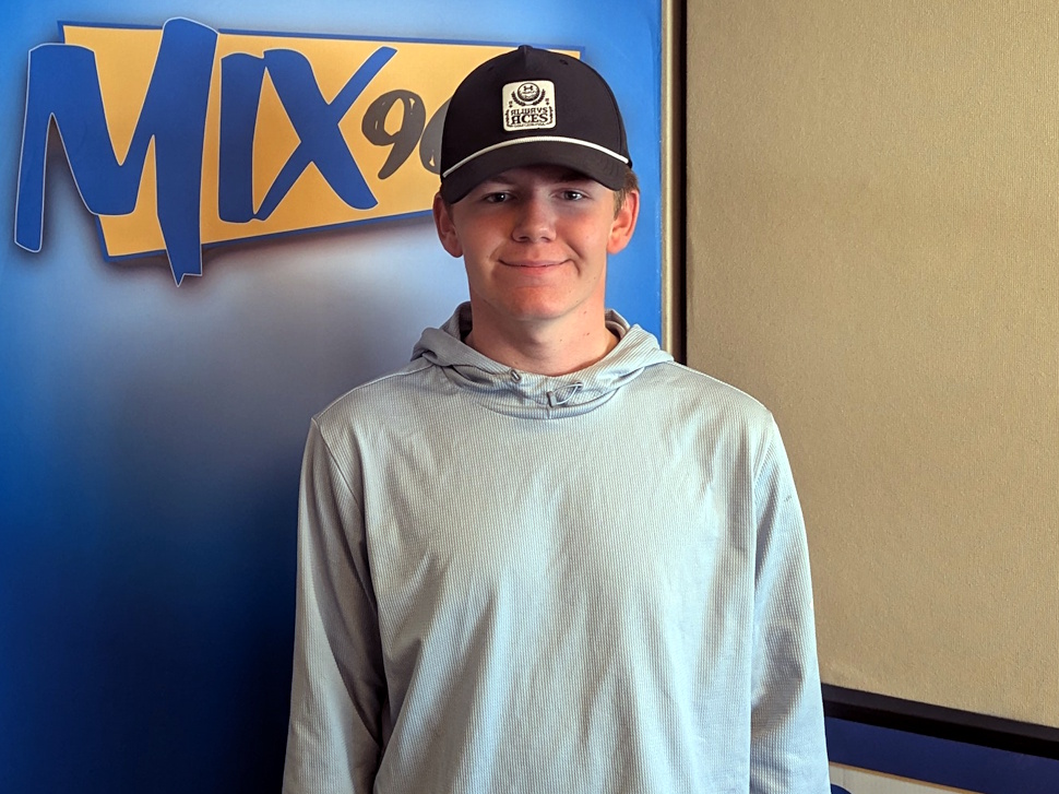 Logan Cairns sits in front of a microphone at the Mix 96 radio studios in Portage la Prairie during an interview.