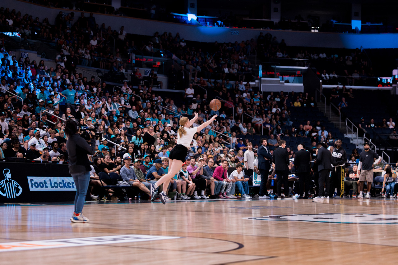 Sydney Last taking the half-court shot challenge at a Winnipeg Sea Bears game. 