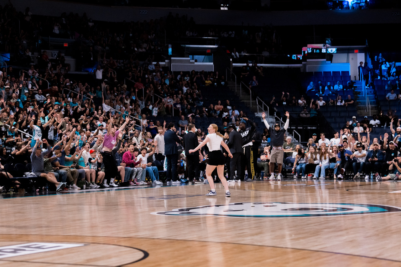 Sydney Last taking the half-court shot challenge at a Winnipeg Sea Bears game. 
