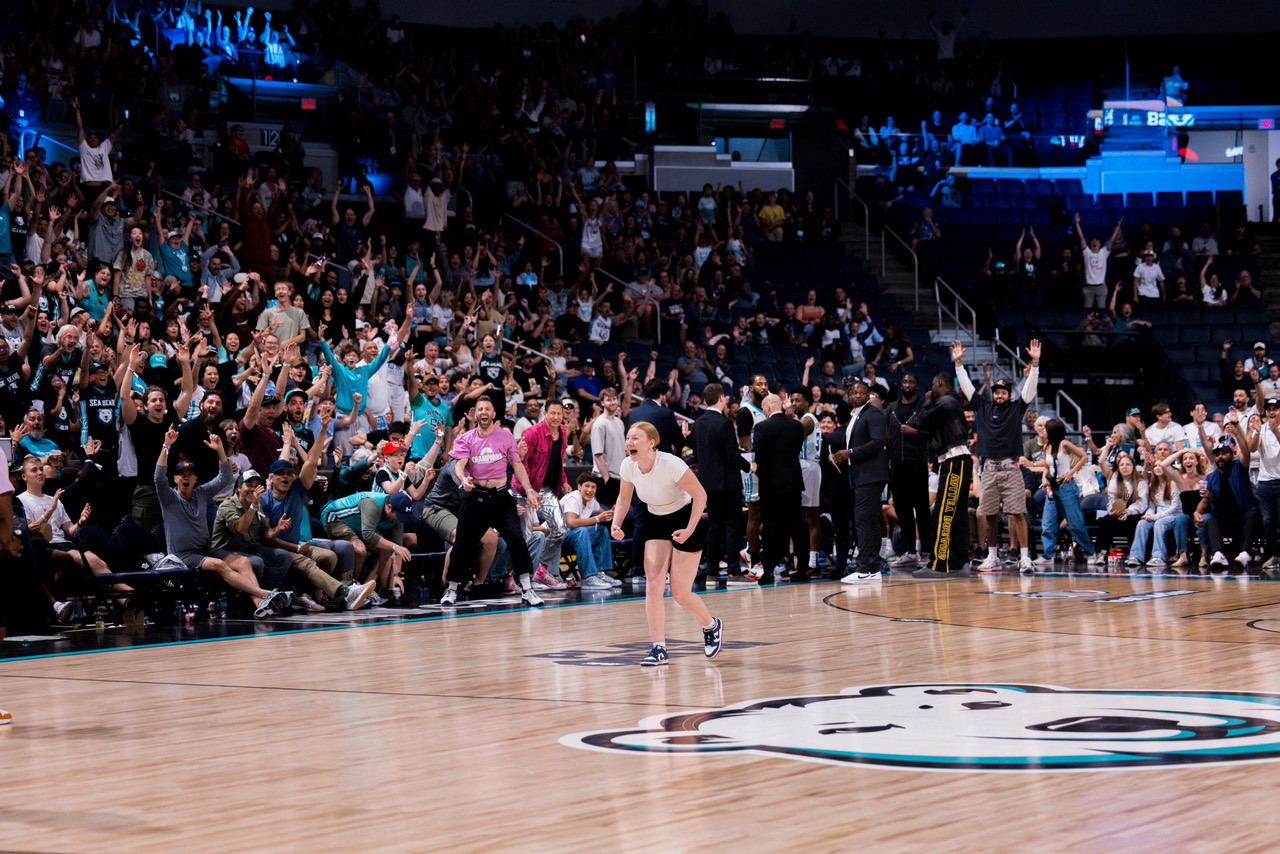 Sydney Last taking the half-court shot challenge at a Winnipeg Sea Bears game. 