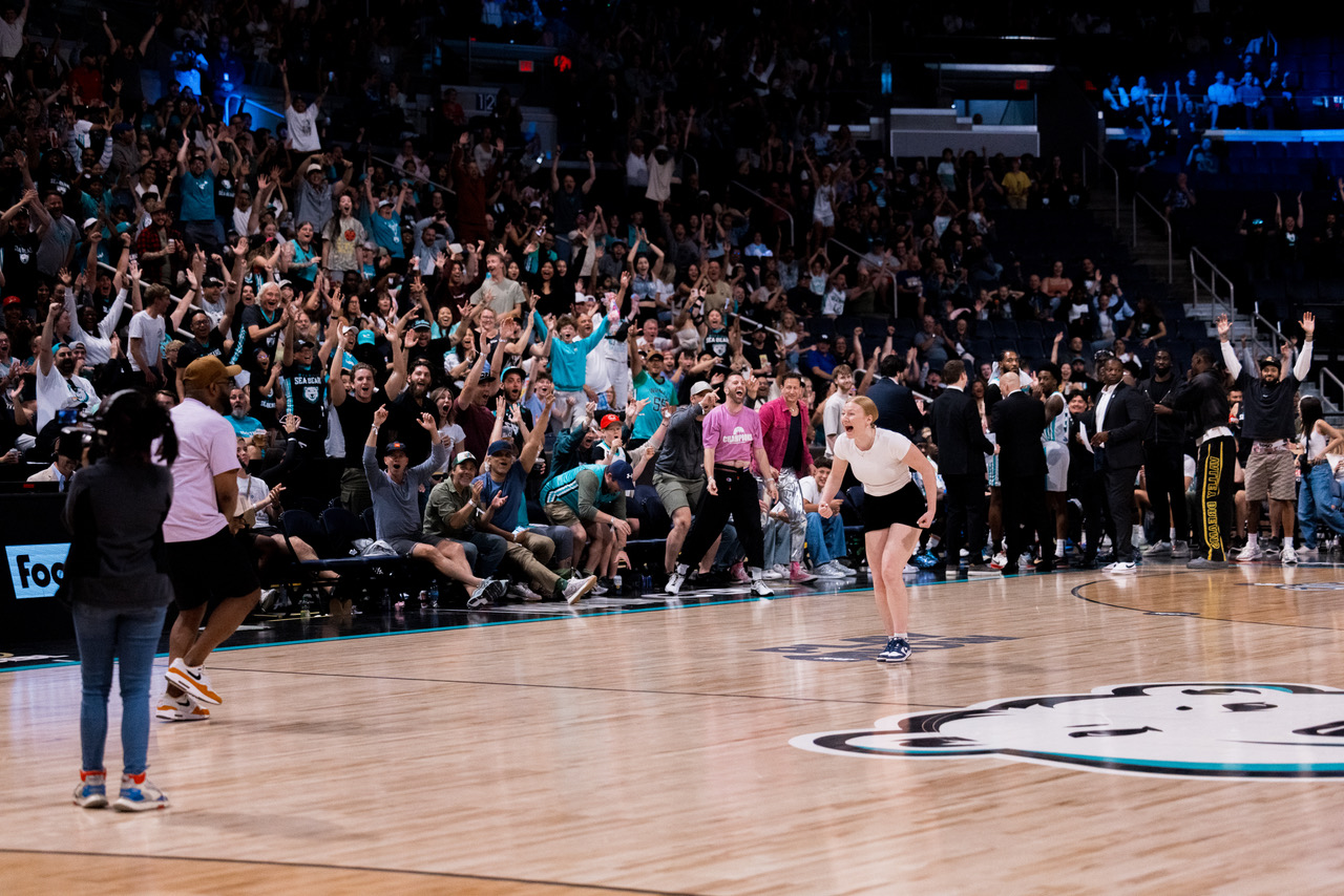 Sydney Last taking the half-court shot challenge at a Winnipeg Sea Bears game. 