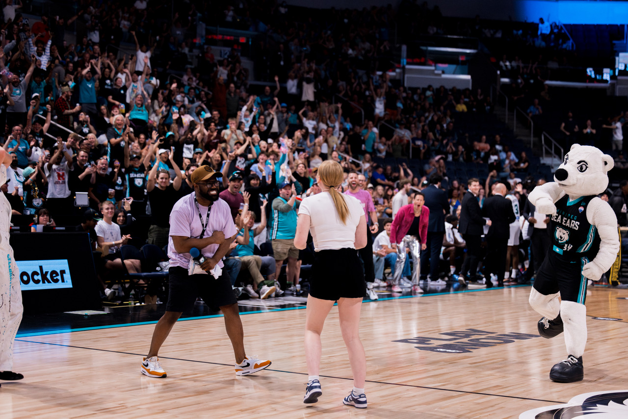 Sydney Last taking the half-court shot challenge at a Winnipeg Sea Bears game. 