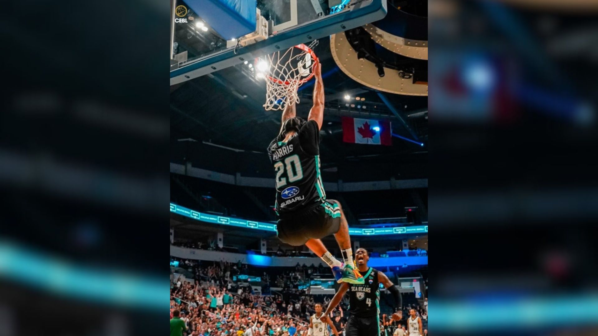 Basketball player doing a reverse dunk 