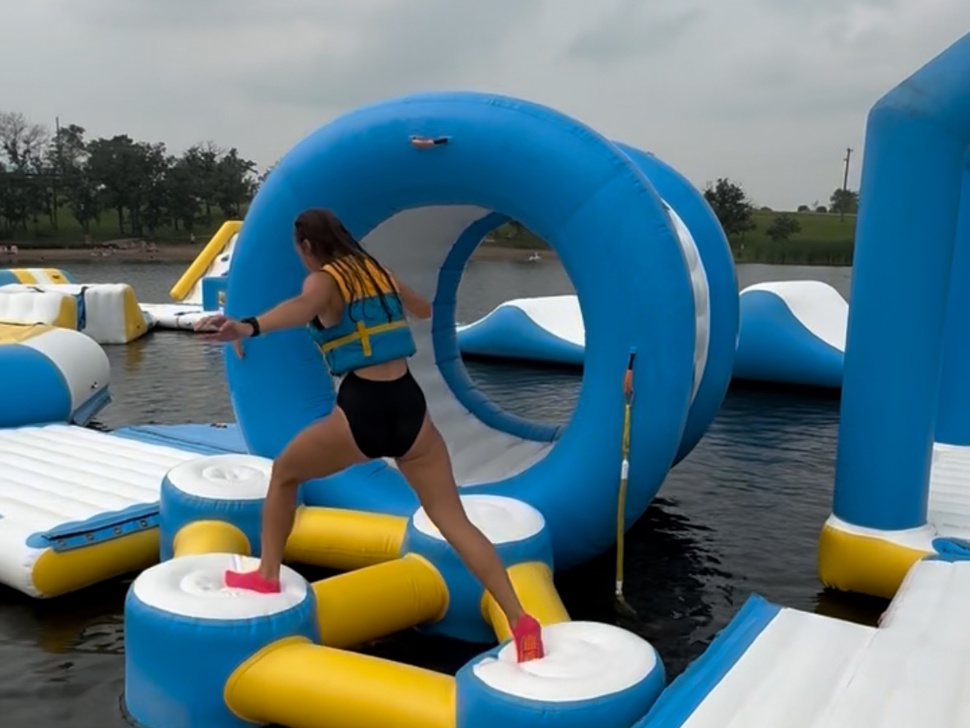 a person goes across an obstacle course
