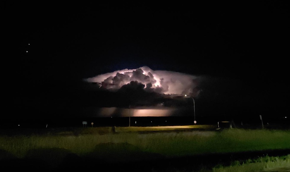 A shot of a storm cloud glowing with lightning. (photo by Hayden Michaels)