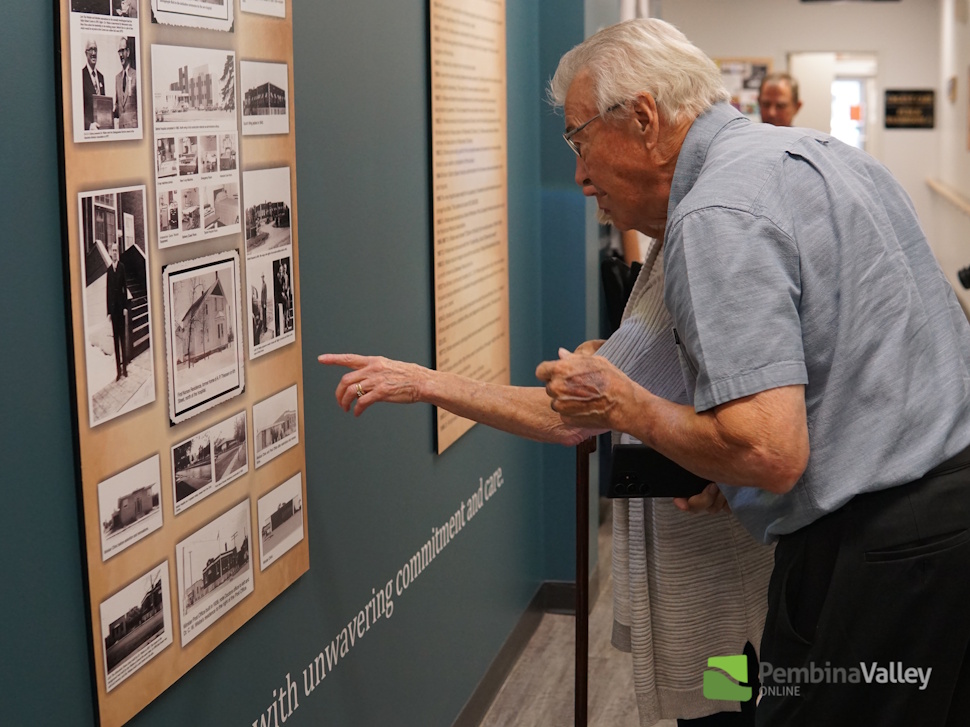 Man looking at the memorial wall