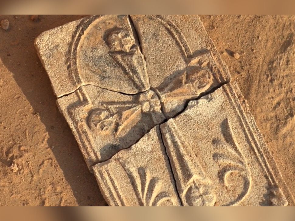 A plaster plaque with a cross on it recently discovered in Abu Dhabi. 