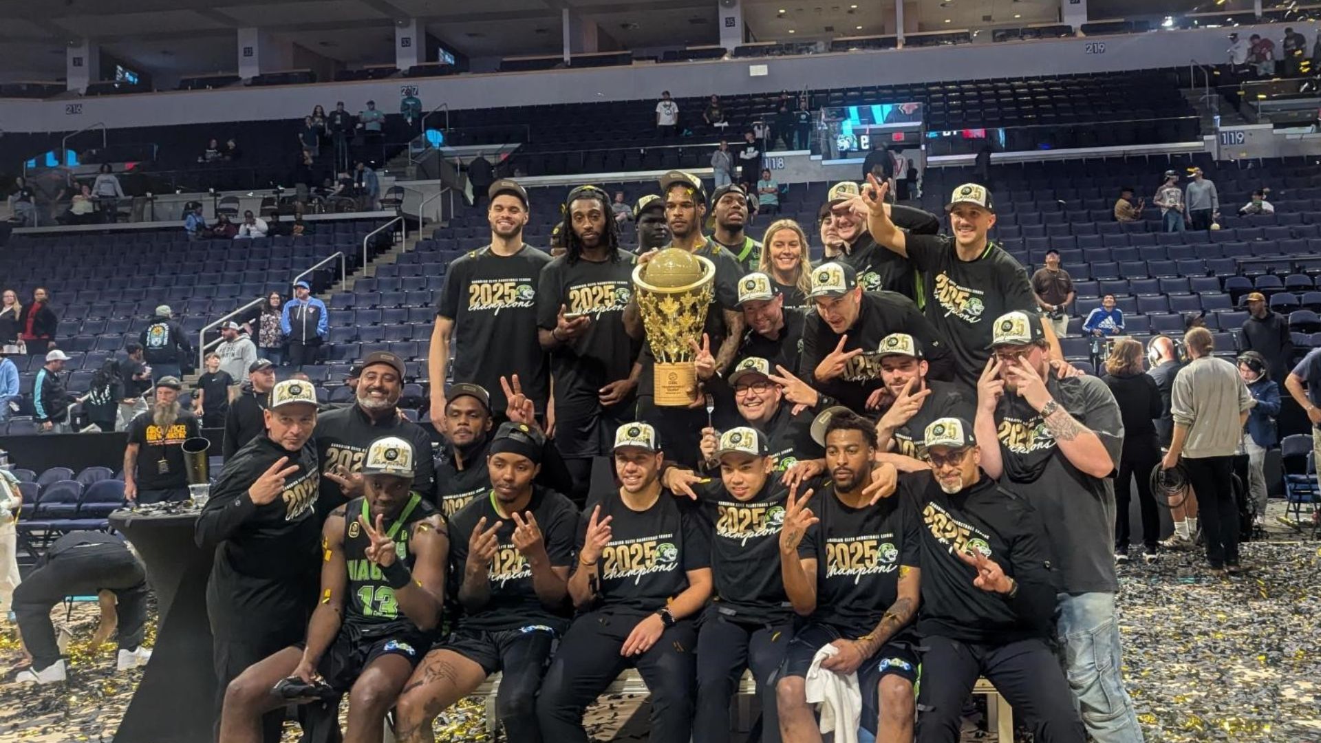 A group posing for a picture after they've won the CEBL Basketball championship