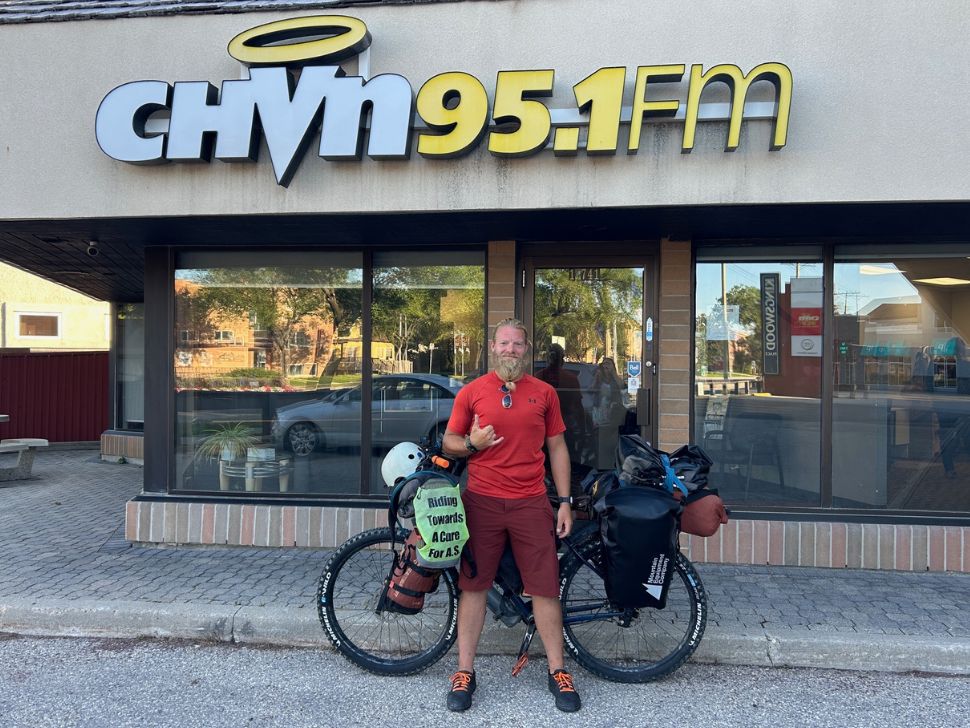Tyler J. Ashton revisiting the CHVN studios on his way back across Canada on his bicycle raising awareness for a disease he himself battles, called A.S. (Sylvia St. Cyr/PNN)