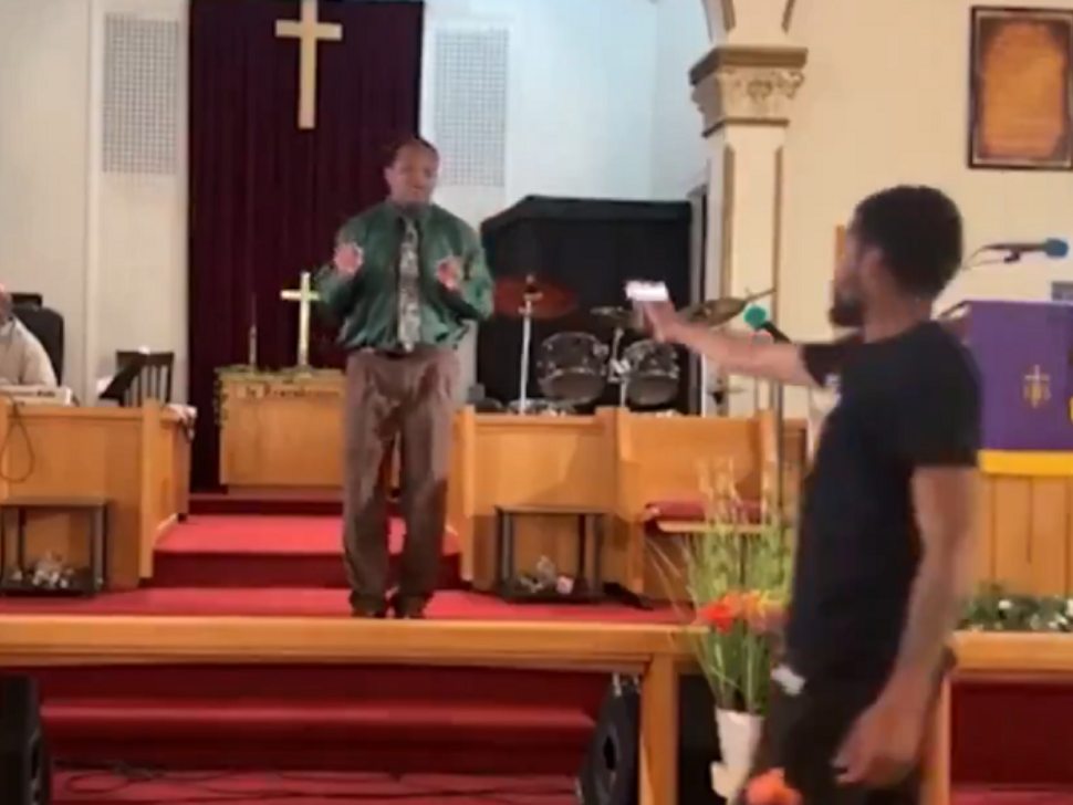 Pastor Glen Germany preaching at his church when a gunman walked up in the middle of the service. 