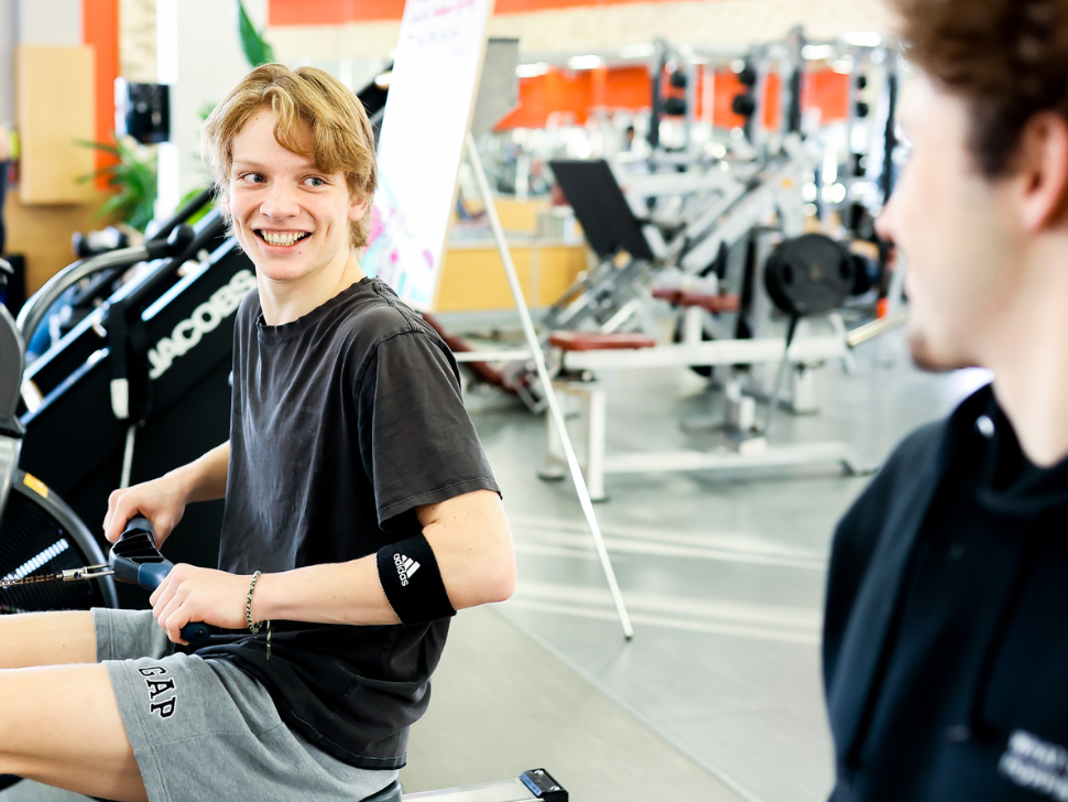 Two youth enjoy exercising at the Y Winnipeg