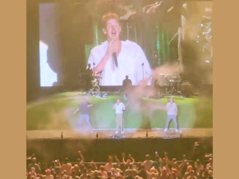 Forrest Franks jumps up and down on stage after breaking back