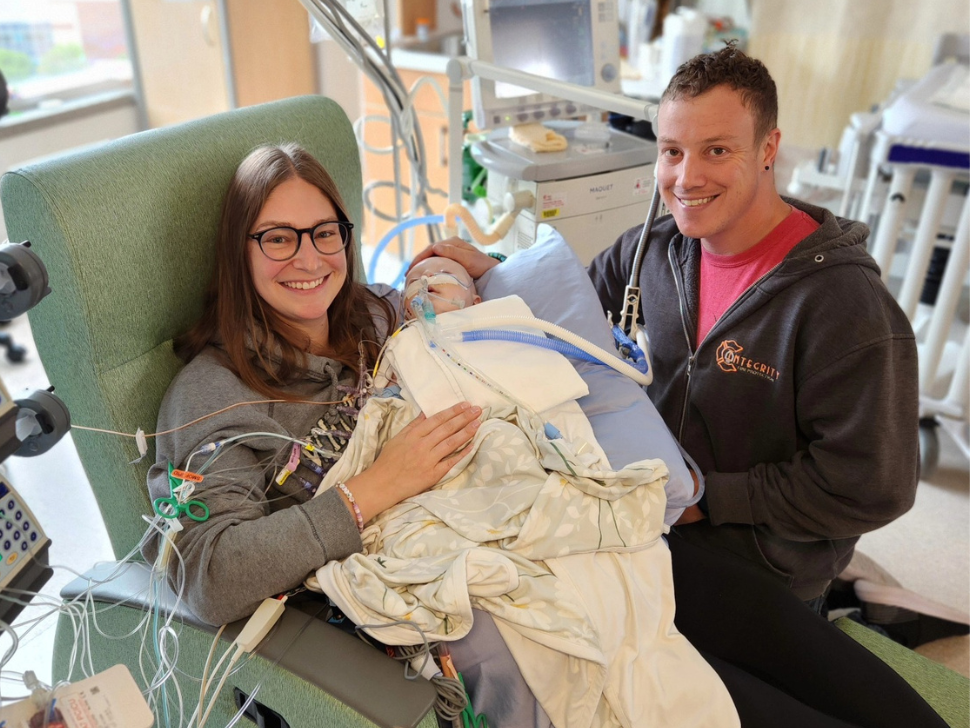 Mike and Courtney Bouwman hold their daughter Daisy