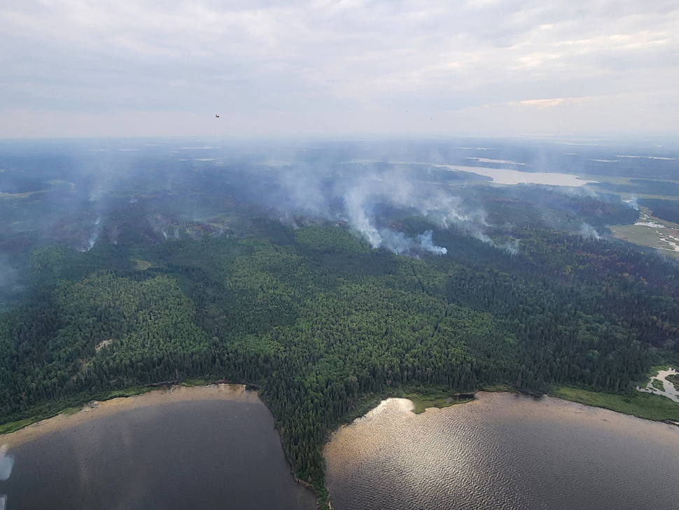An aerial view of the town of Snow Lake where wildfire continues to burn.