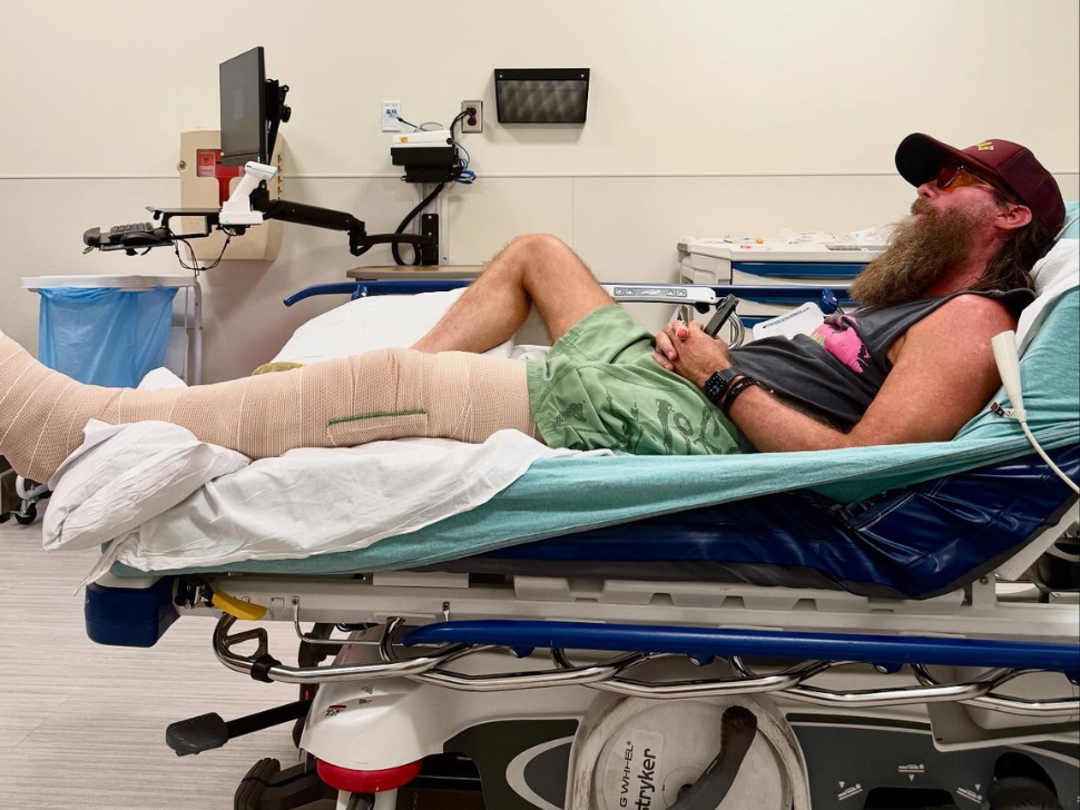 David Crowder laying in a hospital bed after breaking his leg (Crowder Music/Facebook)