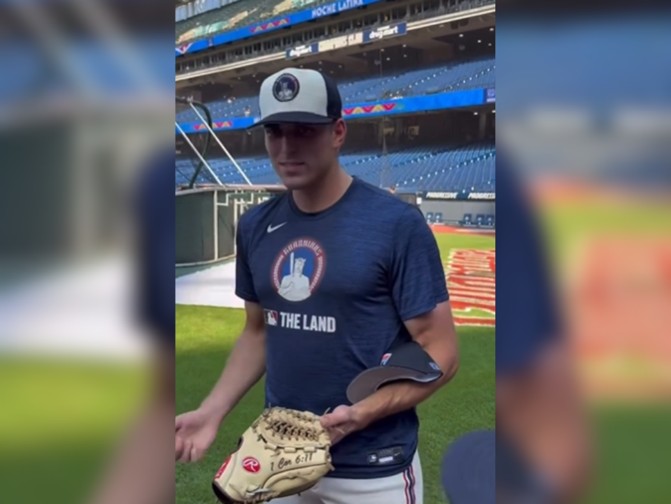 Cade Smith shows baseball glove that has 1 Cor 6:11 written on it. (noblesdarbyiv/Instagram)
