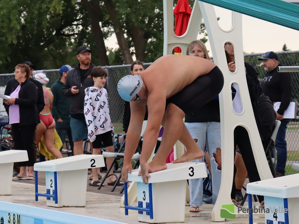 swimmers on a diving block