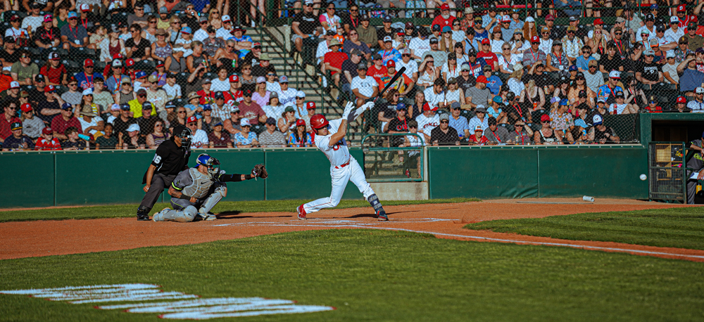 Okotoks Dawgs player swinging big