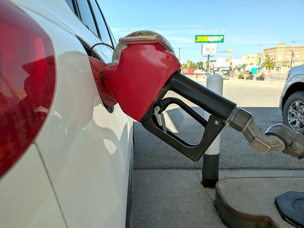 a gas pump filling up a car with fuel