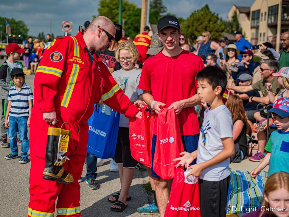 Fire fighters walk the parade route