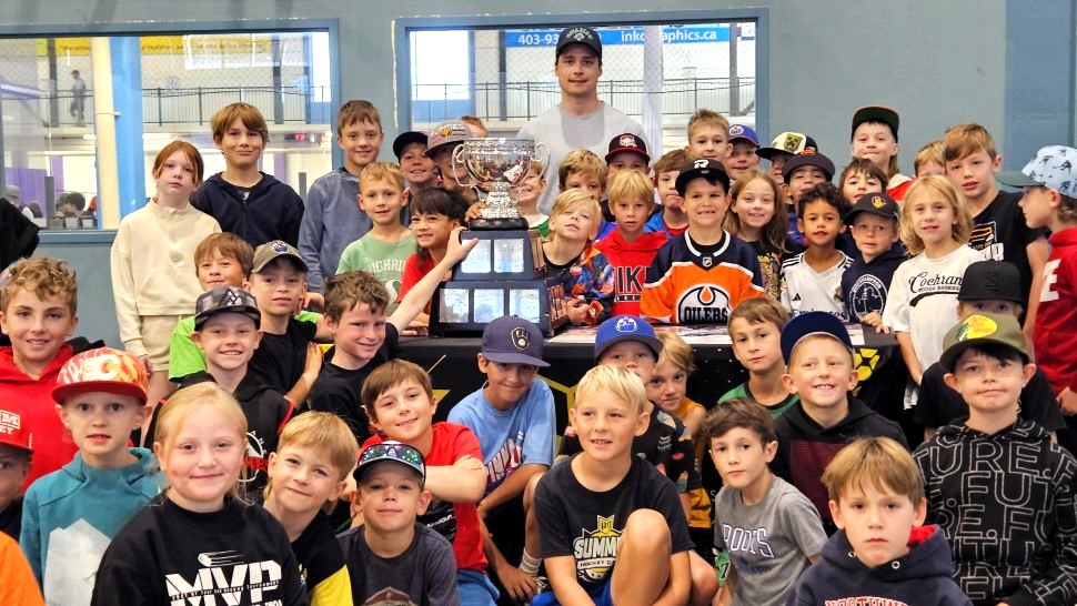Ty Mueller and the Calder Cup in Cochrane