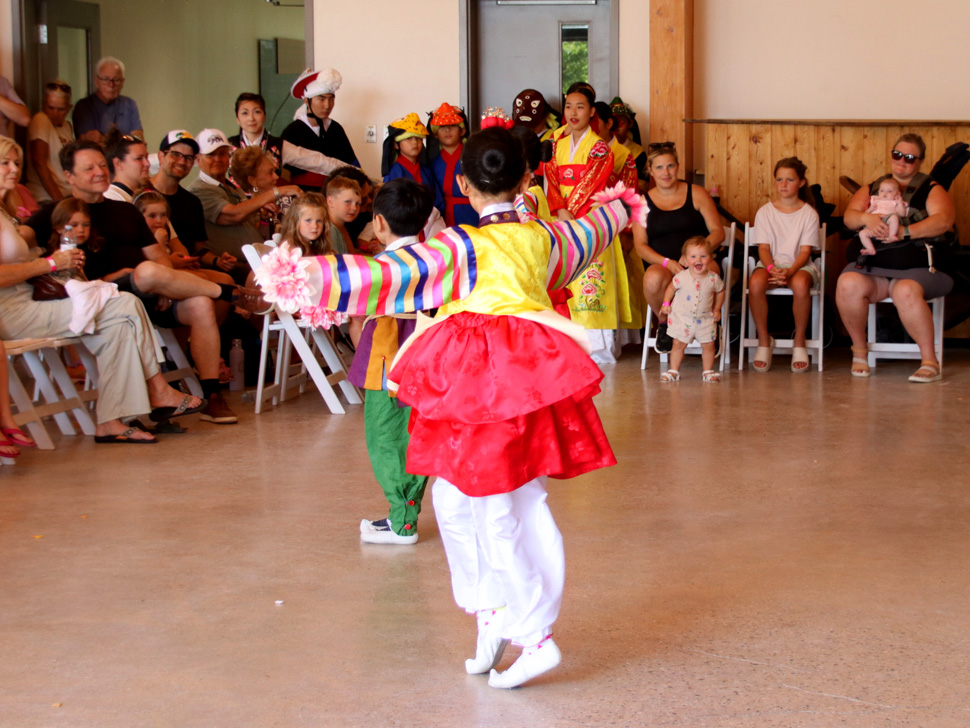 Kids doing Korean Dance in bright costumes