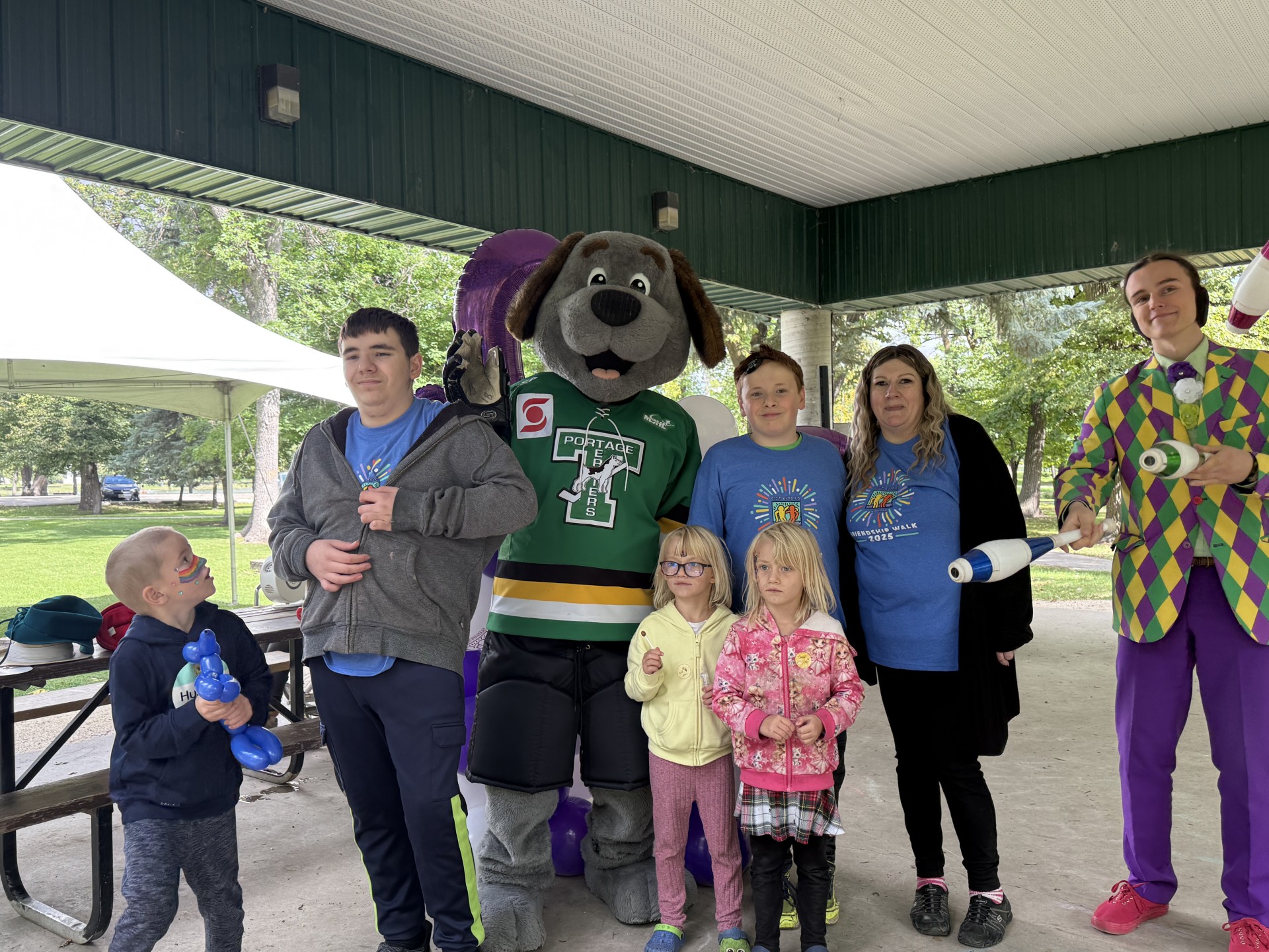 Tara-Marie Hall (second from right) with some of the kids and entertainers who came out to the walk. PortageOnline/Jared Thiessen
