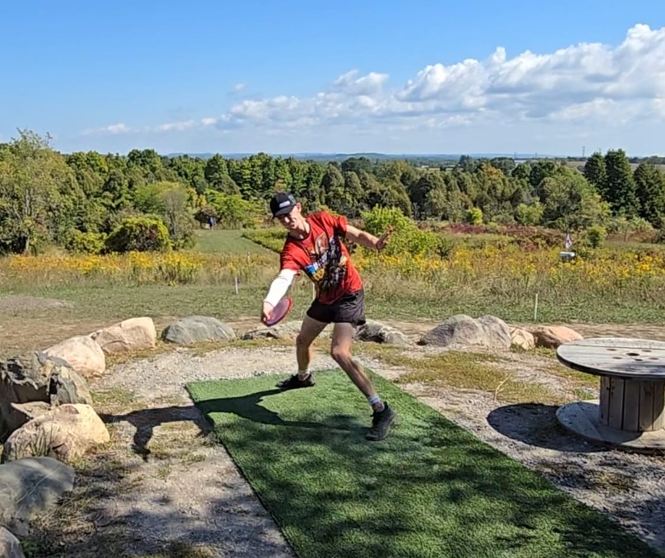 Drew Biette throwing a disc.