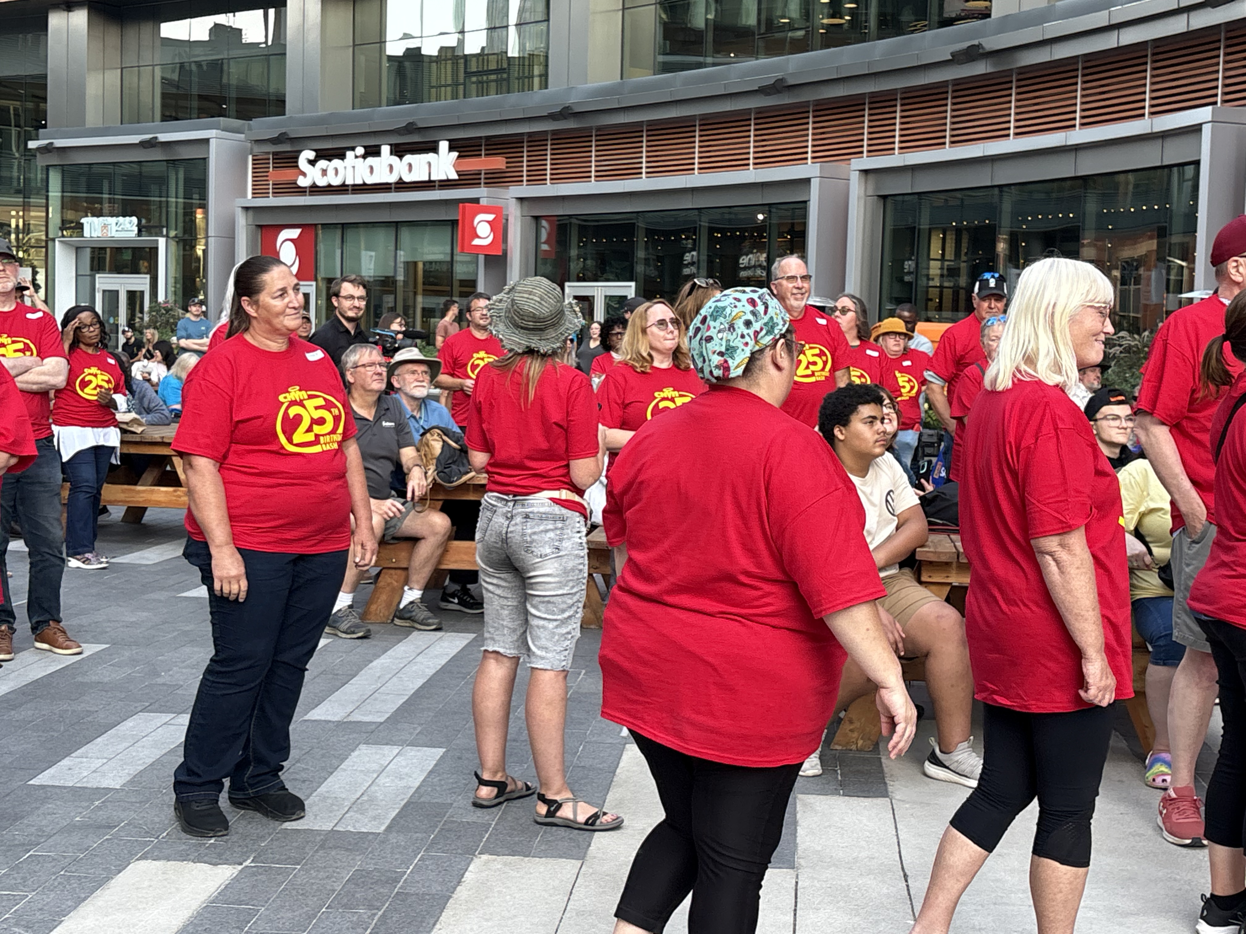 SEVERAL PEOPLE IN RED SHIRTS 