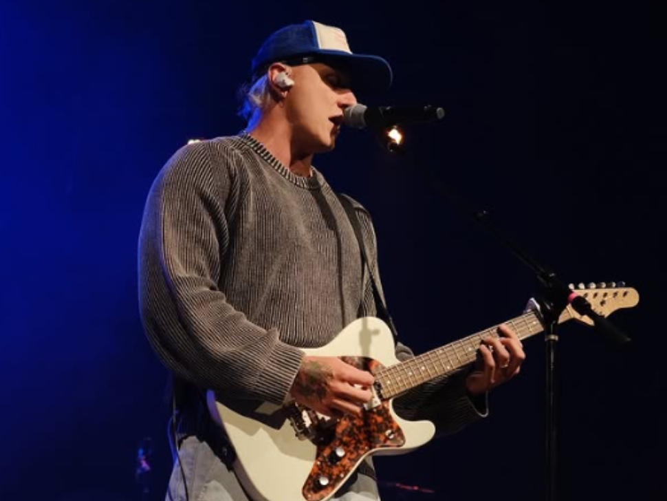 Bodie playing on stage with a guitar. (Instagram)