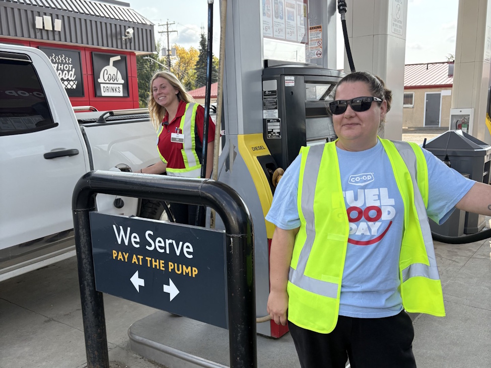 TWO young ladies serving customers at a Co-op gas bar